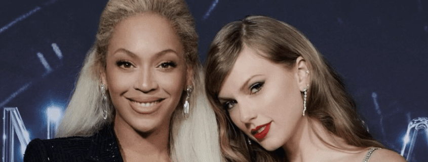 Two women smiling at an event.